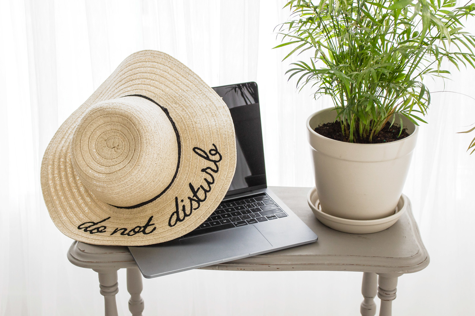 do not disturb hat on laptop