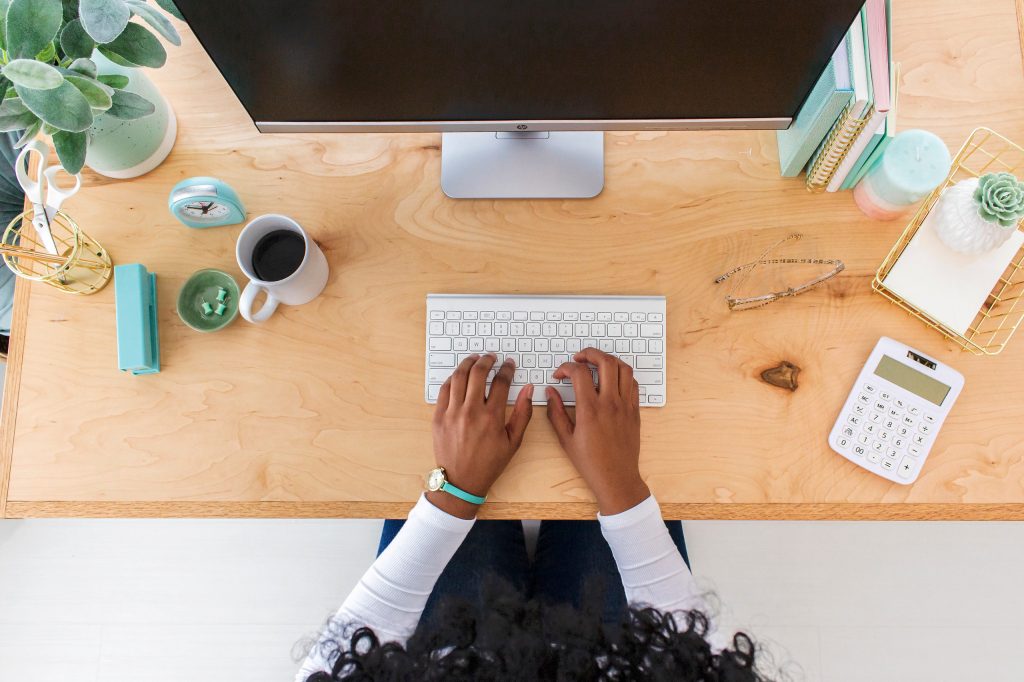 Female blogger and entrepreneur at work desk